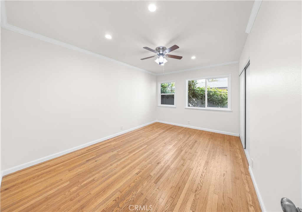 2074 Summit Avenue Pasadena, CA 91103 - Photo 6 of 23 an empty room with wooden floor and windows