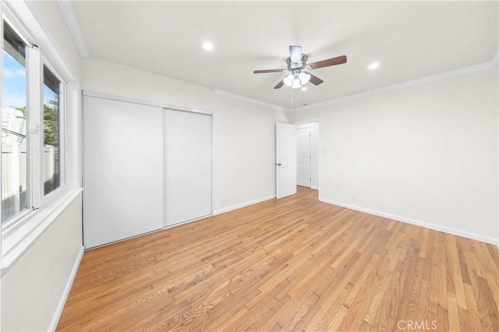 2074 Summit Avenue Pasadena, CA 91103 - Photo 7 of 23 a view of empty room with wooden floor and fan