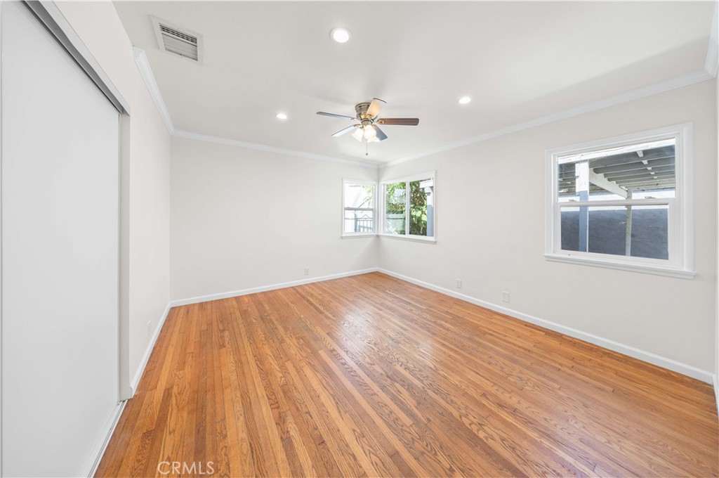 2074 Summit Avenue Pasadena, CA 91103 - Photo 9 of 23 a view of empty room with wooden floor and fan