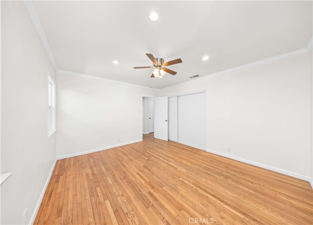 2074 Summit Avenue Pasadena, CA 91103 - Photo 10 of 23 a view of a room with a ceiling fan and wooden floor