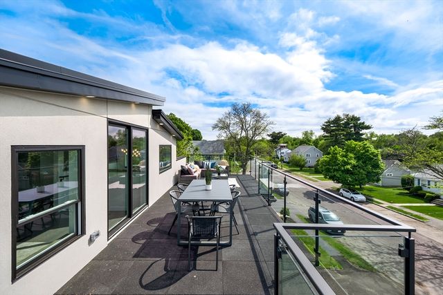 a view of house with outdoor seating and city view