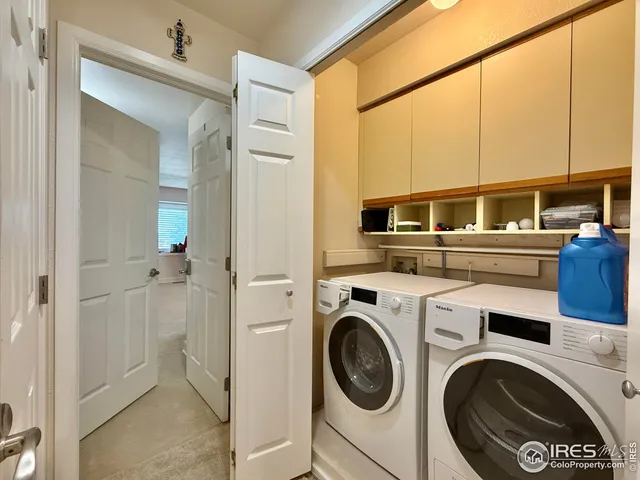 a view of a kitchen with washer and dryer