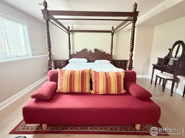 a bedroom with a bed and window