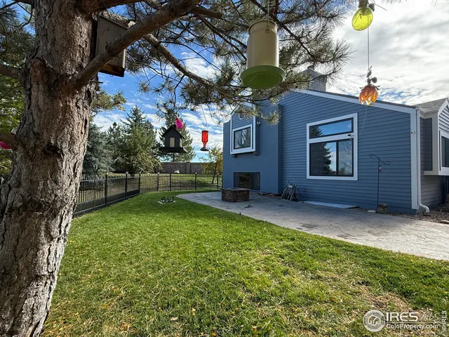 a view of backyard with a barn and a large cactus tree