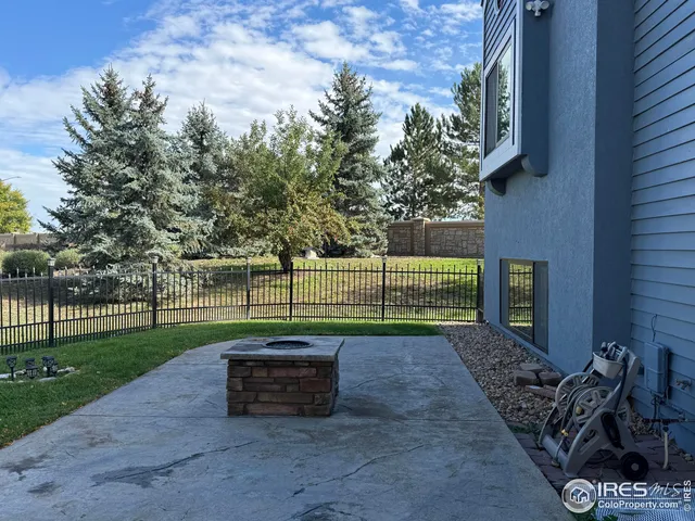 a view of a park with large trees