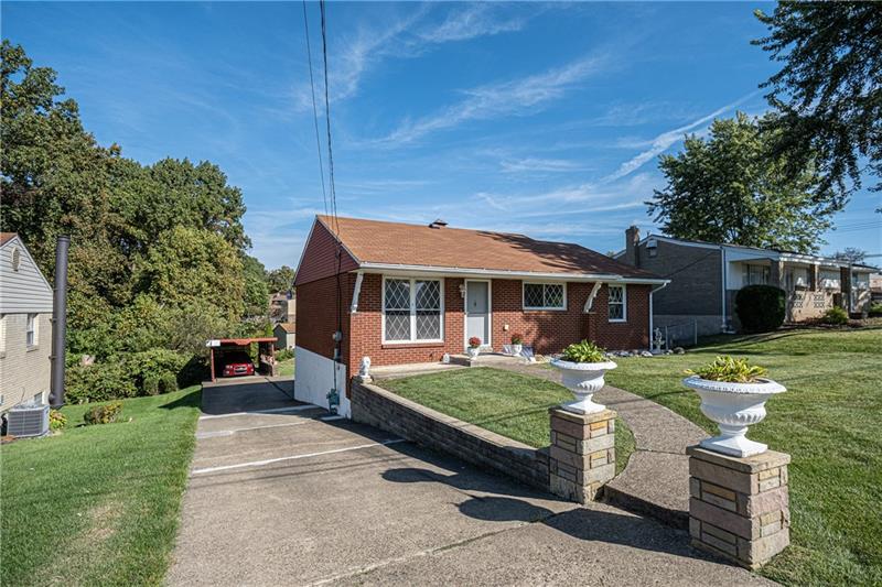 103 Louis Drive McKees Rocks, PA 15136 - Photo 2 of 24 Another view of 103 Louis Court with lovely curb-appeal! One-car carport is visible in this photo. (The car in the carport is NOT for sale.)