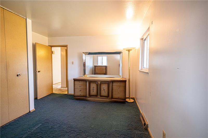 103 Louis Drive McKees Rocks, PA 15136 - Photo 14 of 24 View of the third - and largest - bedroom with window and closet. (Hardwood floors beneath the carpeting.)
