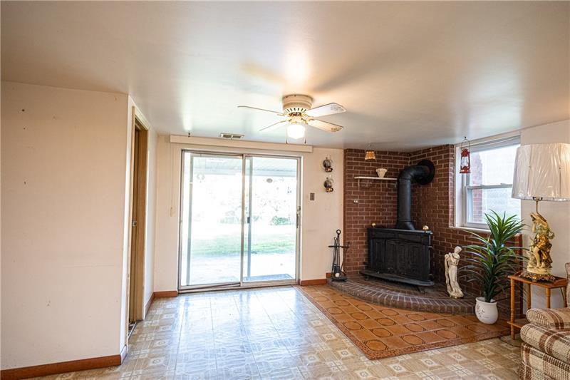 103 Louis Drive McKees Rocks, PA 15136 - Photo 19 of 24 You'll love the comfortable, finished basement with half-bath, wood-stove, separate kitchen/laundry/mud room leading to the one-car garage. Mechanicals behind the closed door. Sliding glass doors lead to spacious covered porch and large, level backyard!