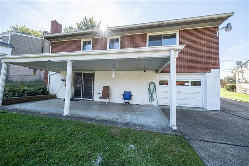103 Louis Drive McKees Rocks, PA 15136 - Photo 23 of 24 Private covered porch provides space to entertain friends and family, or simply relax in this quiet, level backyard overlooking the woods. Lovey!