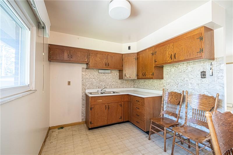 103 Louis Drive McKees Rocks, PA 15136 - Photo 7 of 24 Another view of the eat-in kitchen with stainless sink.