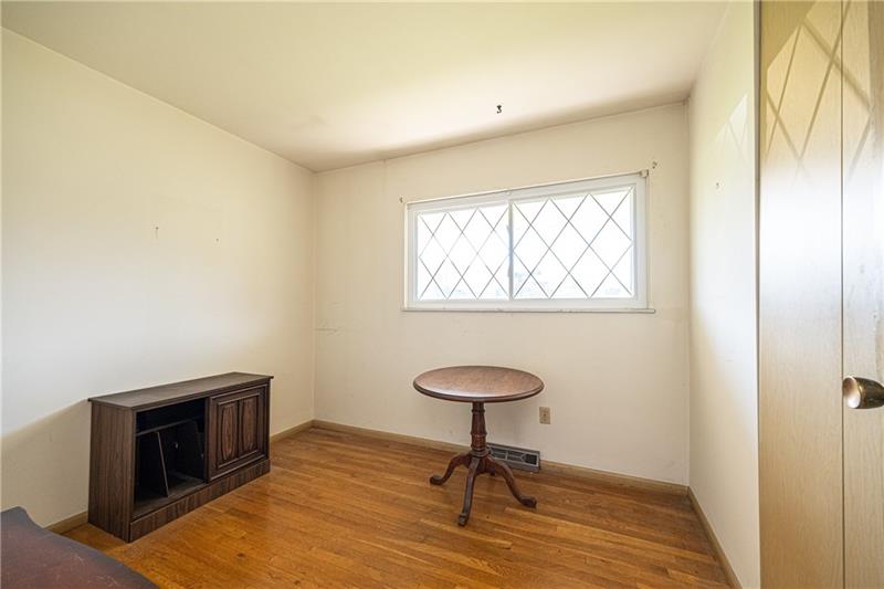 103 Louis Drive McKees Rocks, PA 15136 - Photo 10 of 24 View of first bedroom with hardwood floors and large closet.