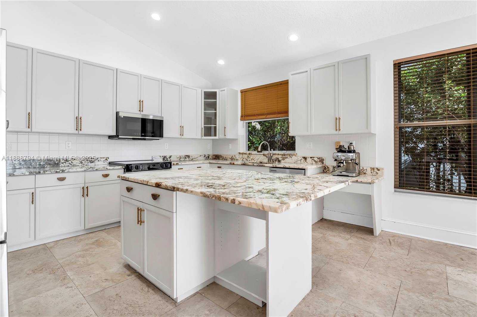2791 Southwest 190th Avenue Miramar, FL 33029 - Photo 11 of 41 a kitchen that has a lot of white cabinets and stainless steel appliances