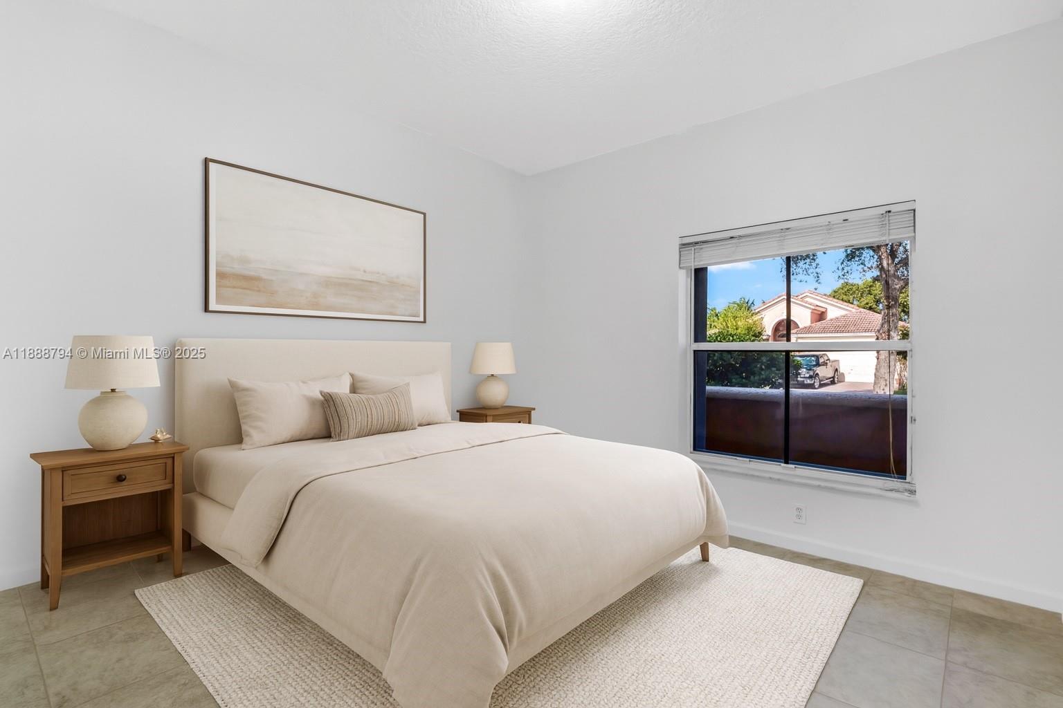 2791 Southwest 190th Avenue Miramar, FL 33029 - Photo 18 of 41 a bedroom with a bed and wooden floor