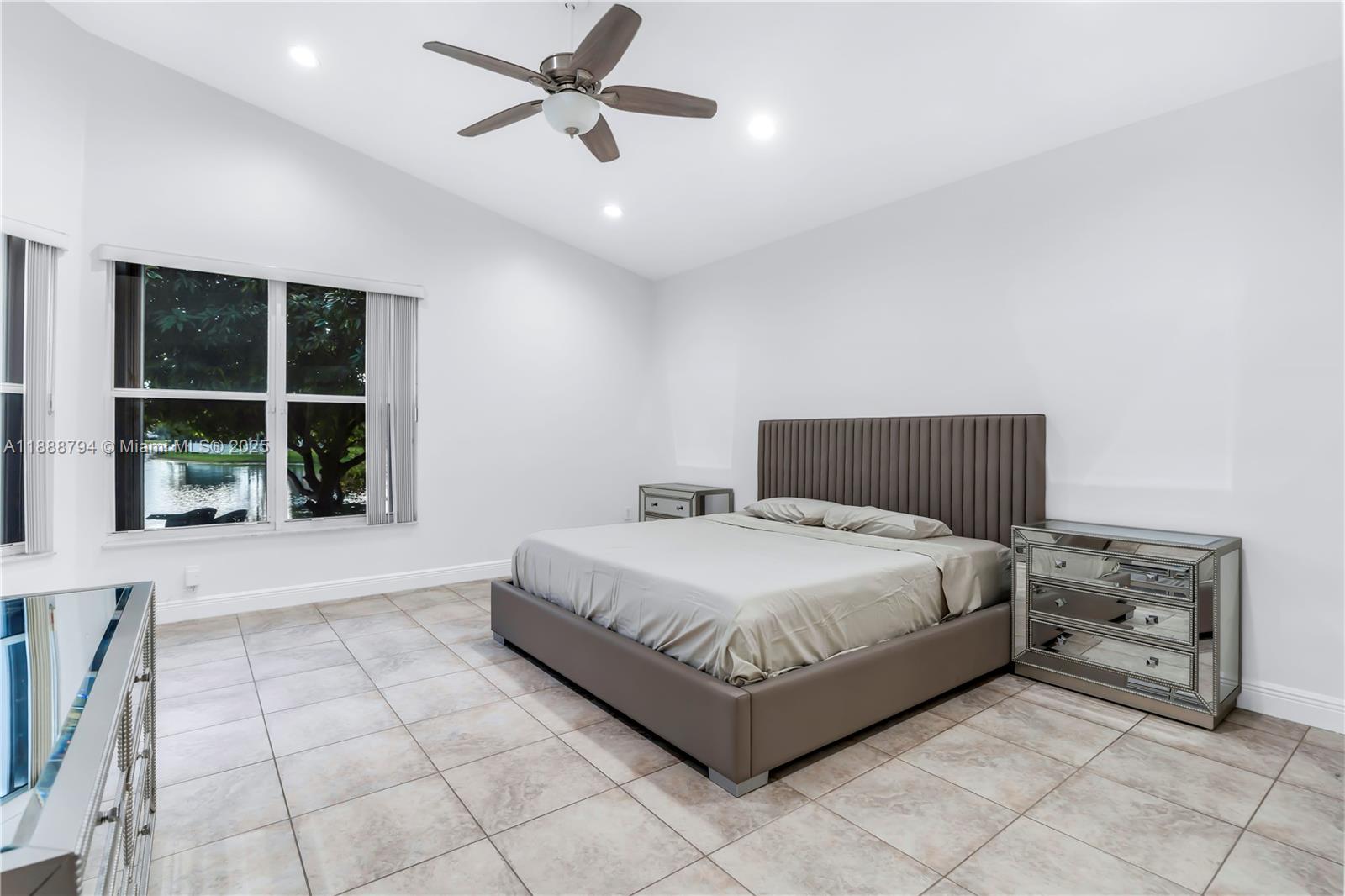 2791 Southwest 190th Avenue Miramar, FL 33029 - Photo 19 of 41 a spacious bedroom with a bed and a window