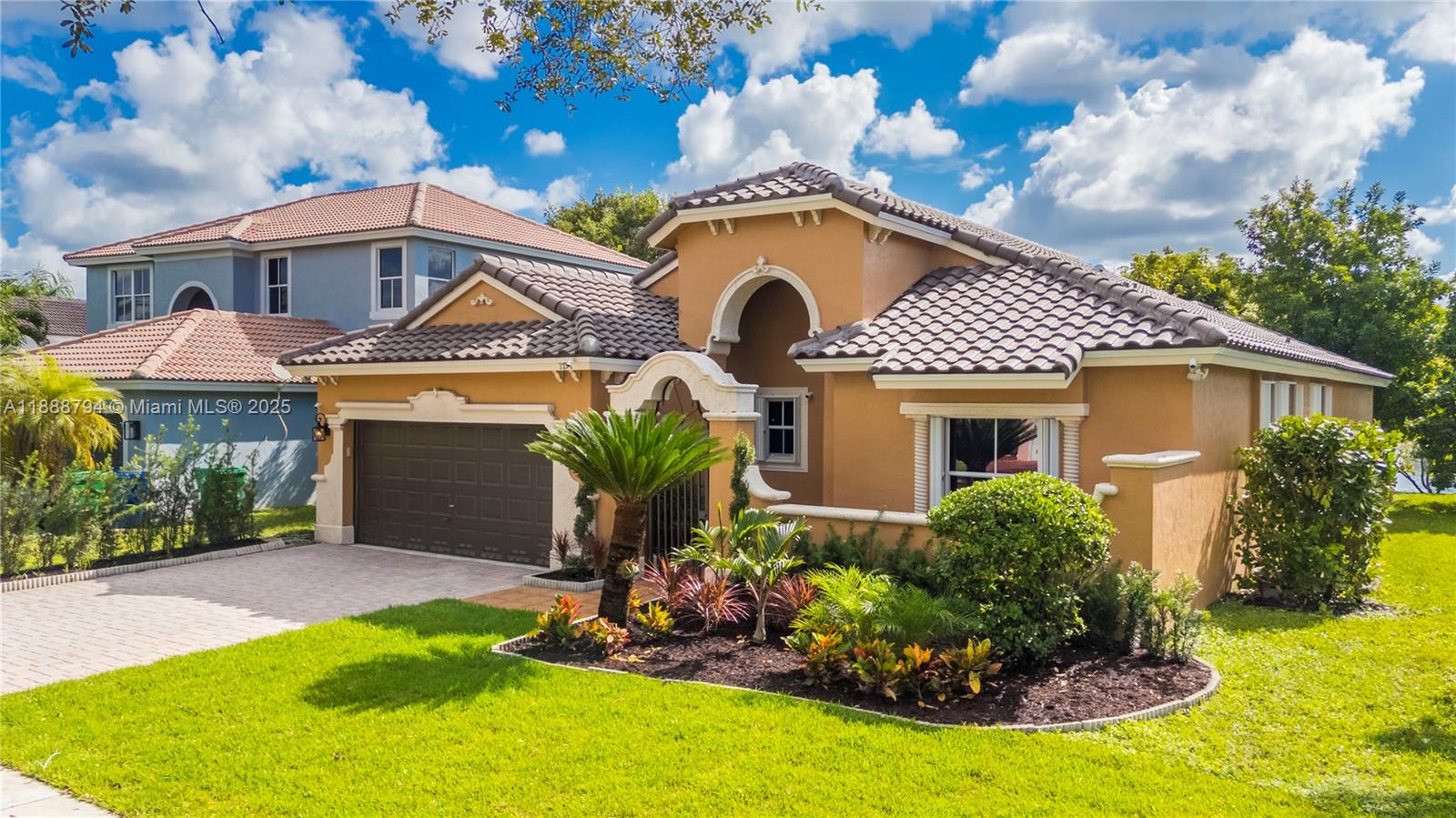 2791 Southwest 190th Avenue Miramar, FL 33029 - Photo 40 of 41 a front view of a house with a yard garage and outdoor seating