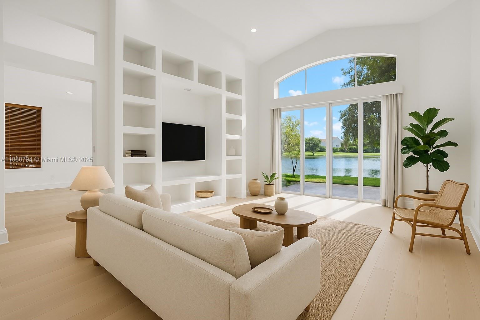 2791 Southwest 190th Avenue Miramar, FL 33029 - Photo 4 of 41 a living room with furniture and a flat screen tv