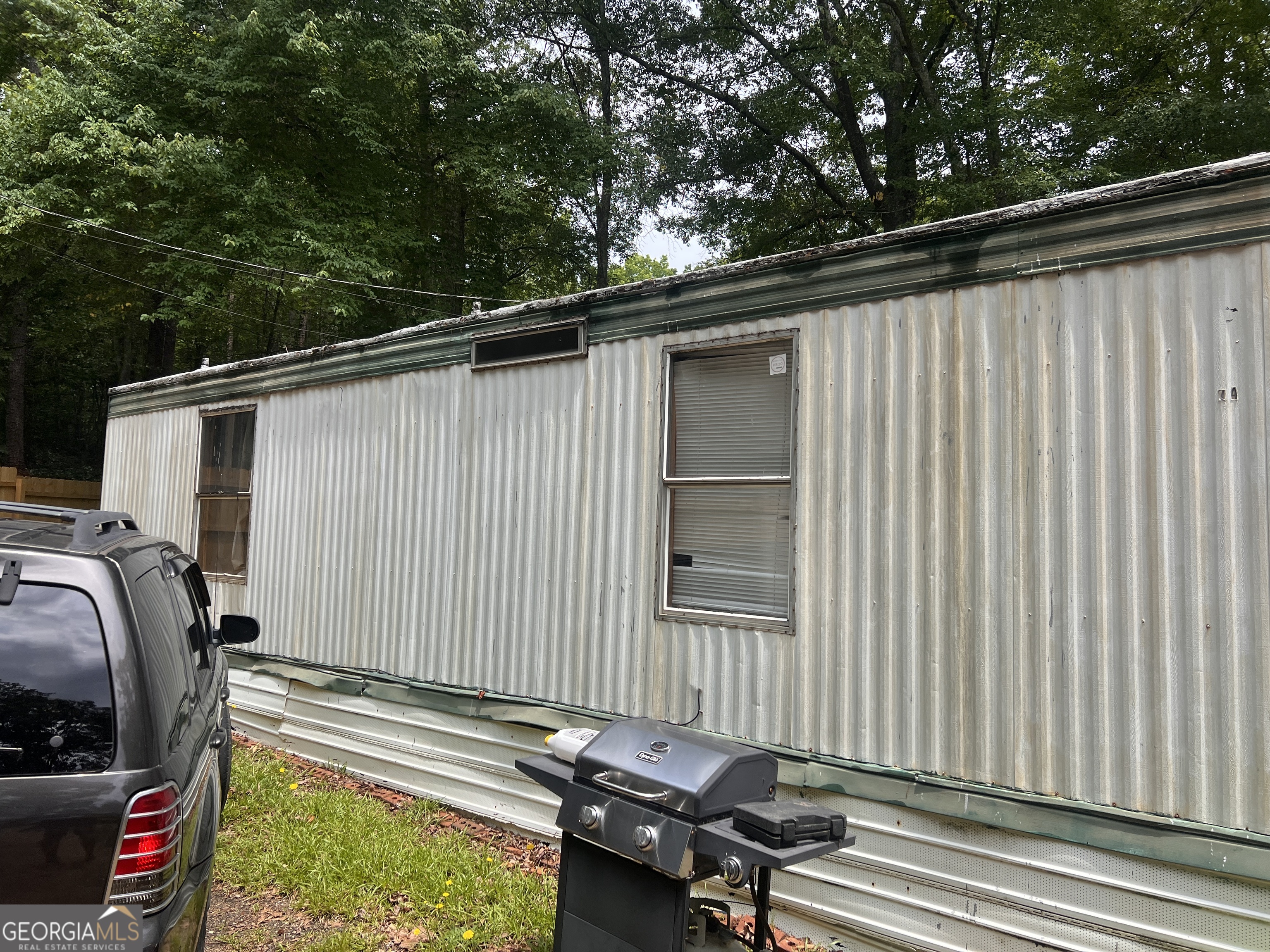 a backyard of a house with outdoor seating