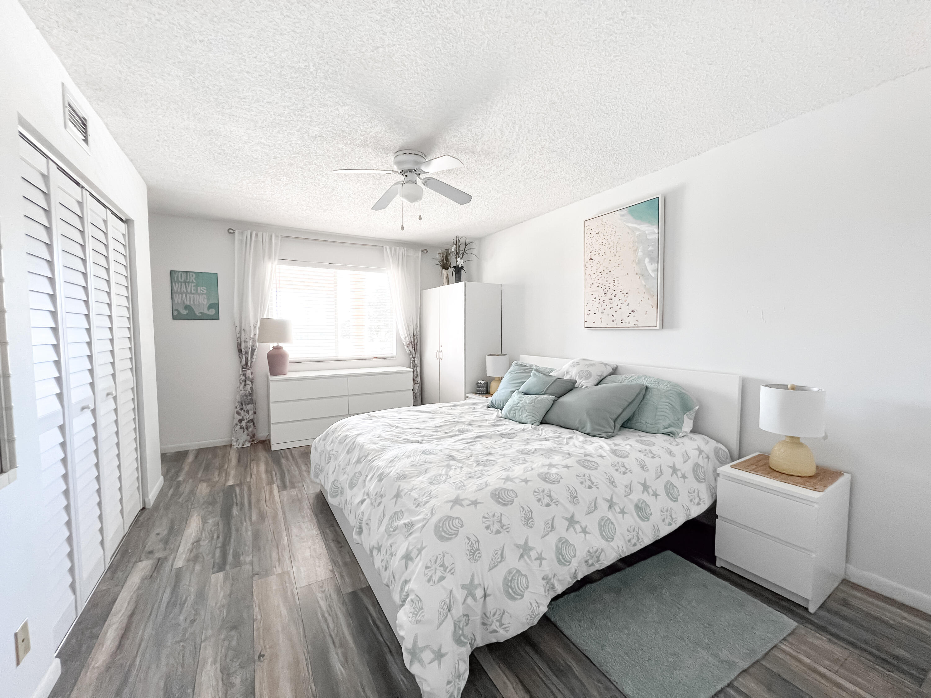 353 Highway 1, Unit B309 Jupiter, FL 33477 - Photo 12 of 24 a bedroom with a bed and a window
