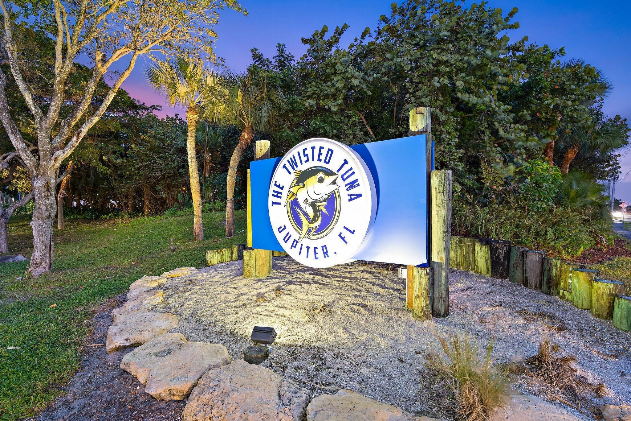 353 Highway 1, Unit B309 Jupiter, FL 33477 - Photo 21 of 24 a sign that is on a brick wall