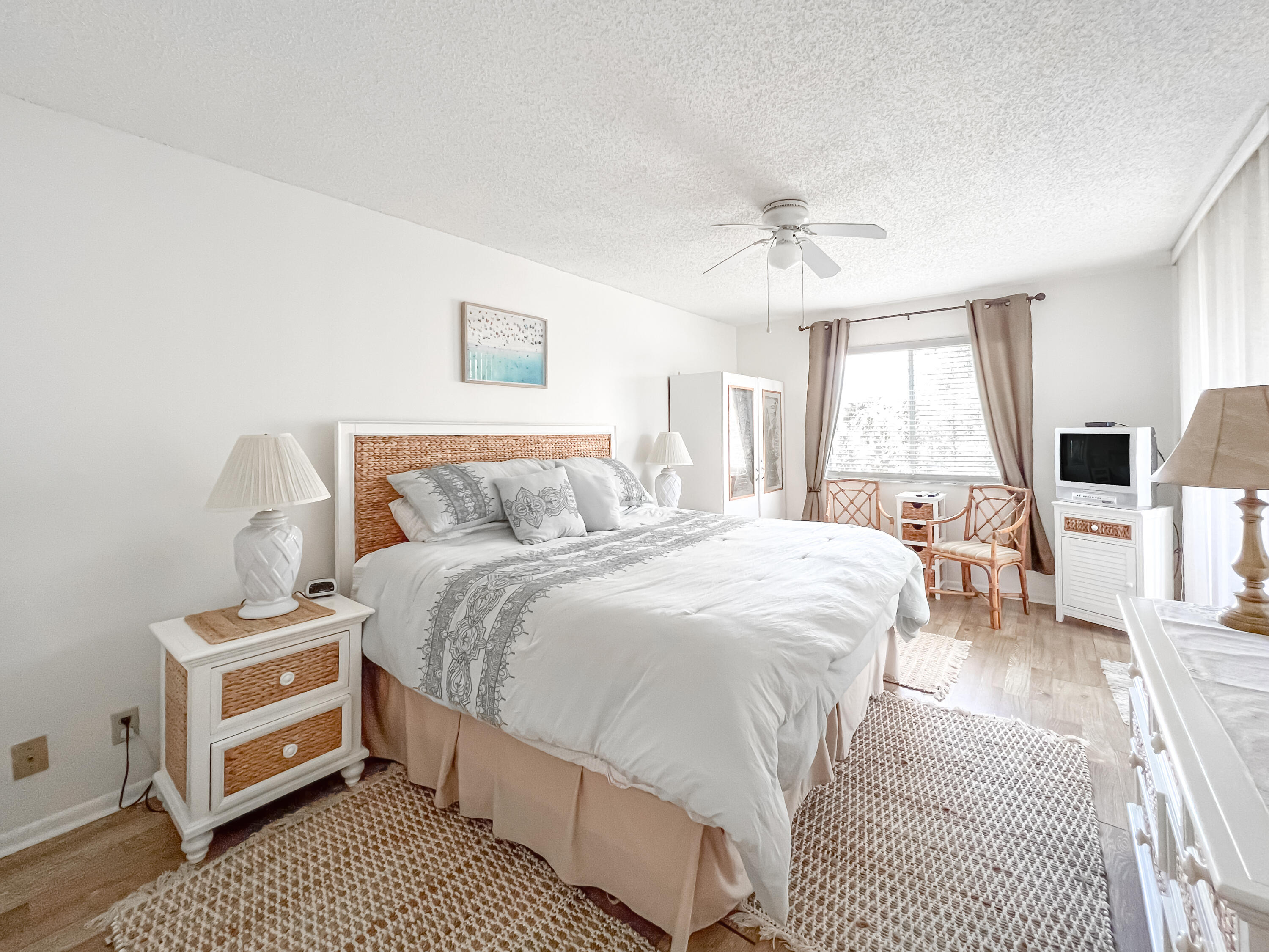 353 Highway 1, Unit B309 Jupiter, FL 33477 - Photo 7 of 24 a spacious bedroom with a bed a couch and large window