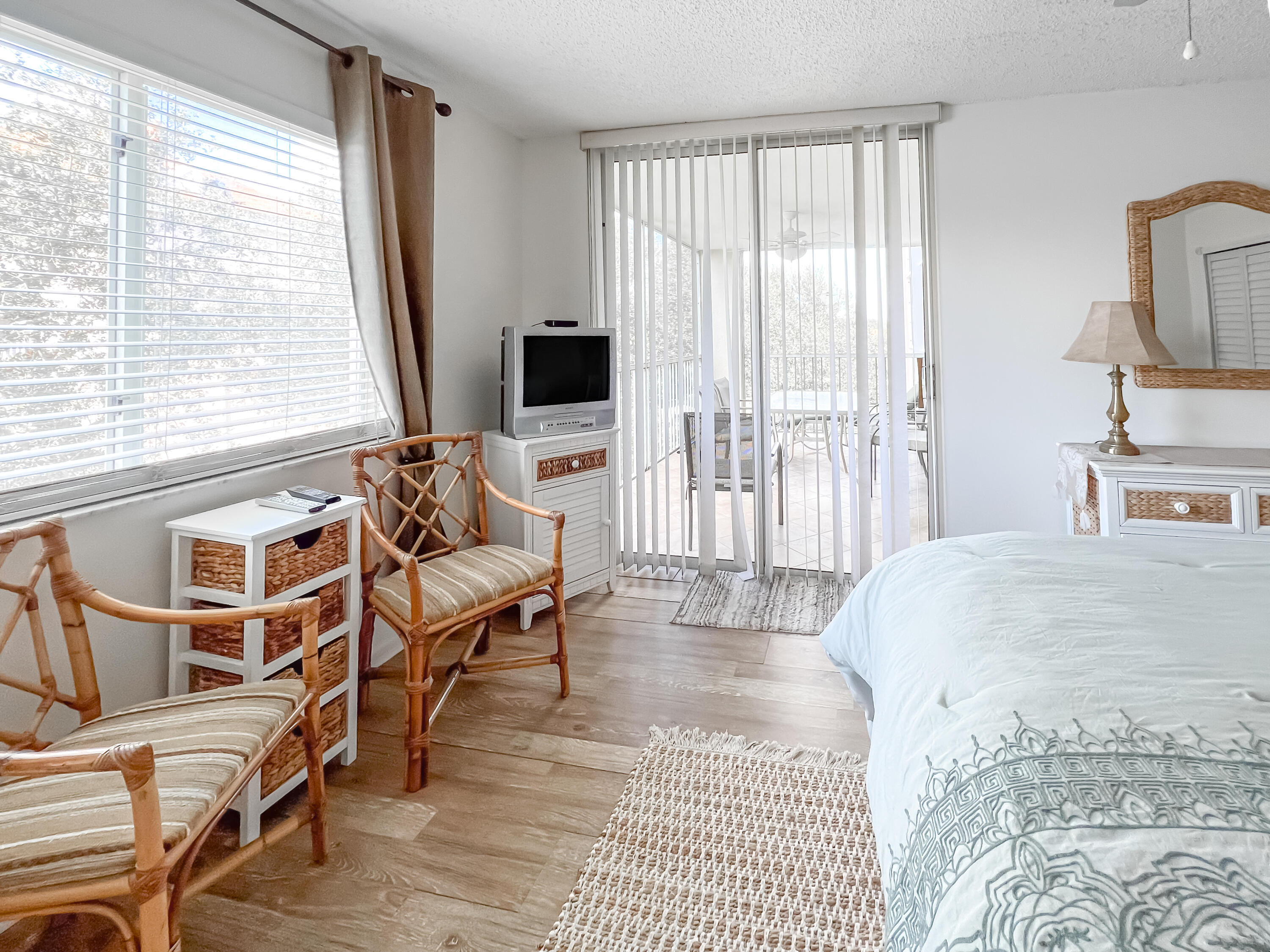 353 Highway 1, Unit B309 Jupiter, FL 33477 - Photo 9 of 24 a spacious bedroom with a bed a couch and large window