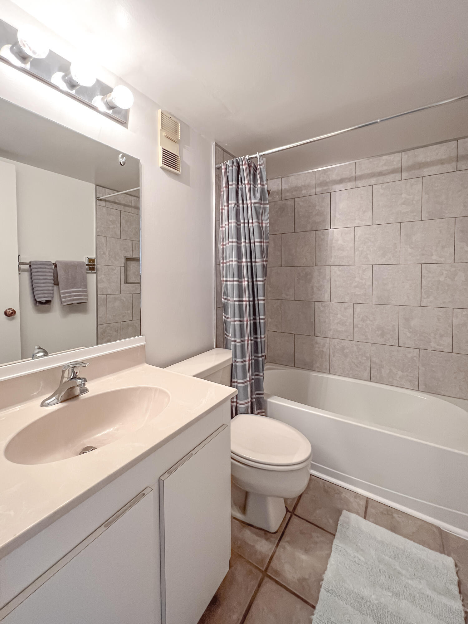 353 Highway 1, Unit B309 Jupiter, FL 33477 - Photo 10 of 24 a bathroom with a sink toilet and shower