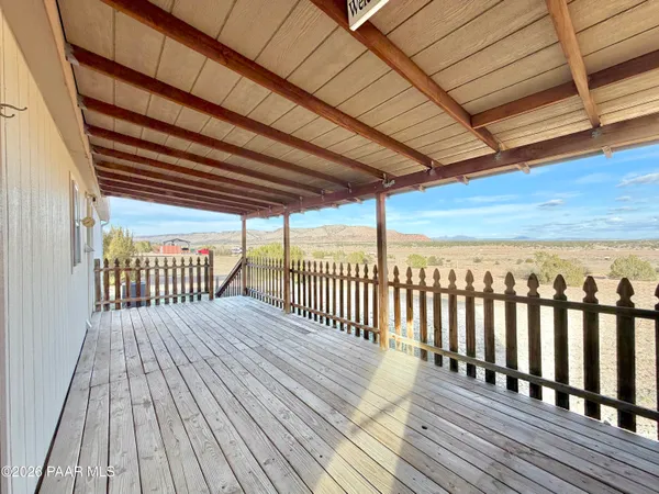 a view of backyard with wooden floor