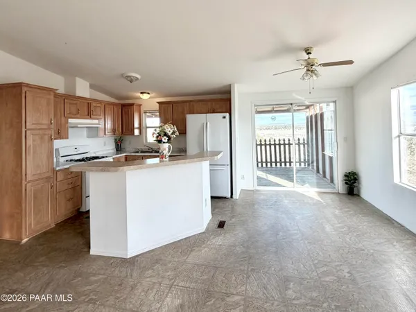 a view of a kitchen with electric appliances