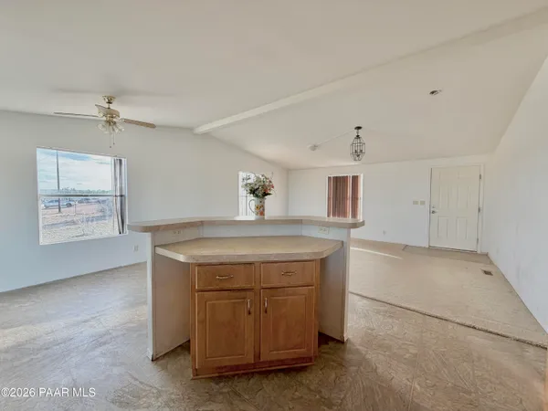 a view of cabinets with window and furniture