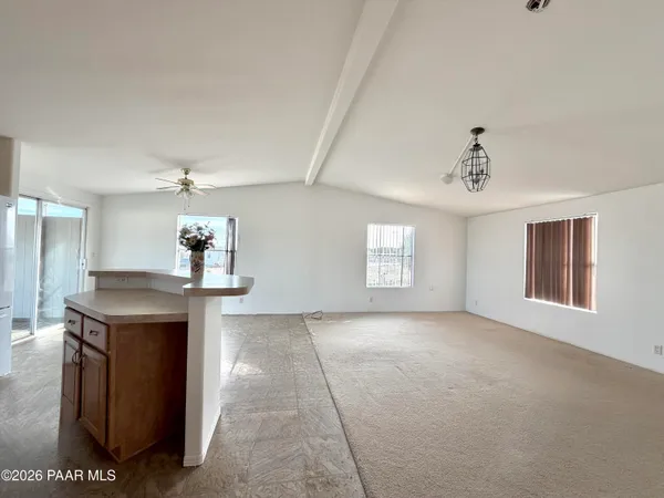 a view of a kitchen with a sink and a chandelier