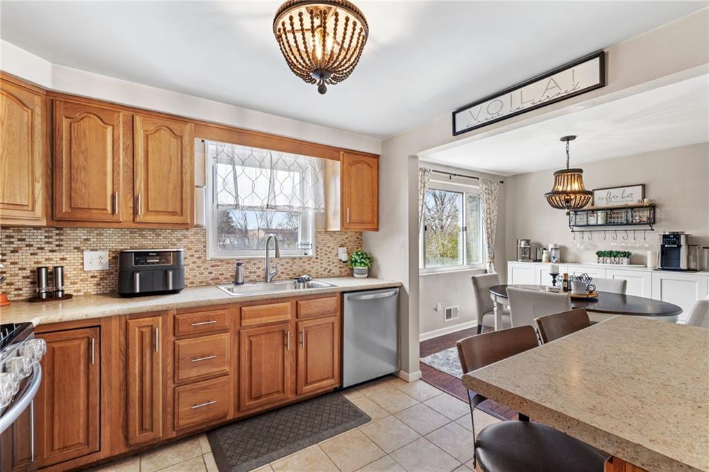 1075 Fiddleback Drive McKees Rocks, PA 15136 - Photo 14 of 34 a large kitchen with lots of counter space a sink and cabinets