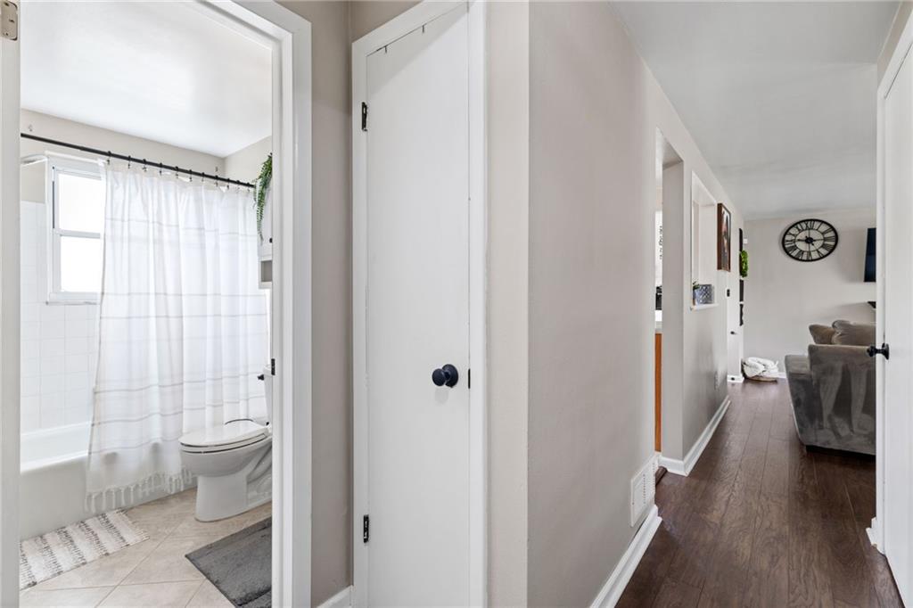 1075 Fiddleback Drive McKees Rocks, PA 15136 - Photo 15 of 34 a walk in closet with wooden floor