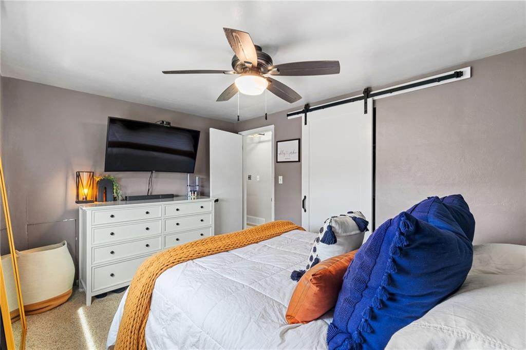 1075 Fiddleback Drive McKees Rocks, PA 15136 - Photo 17 of 34 a spacious bedroom with a bed and a flat screen tv