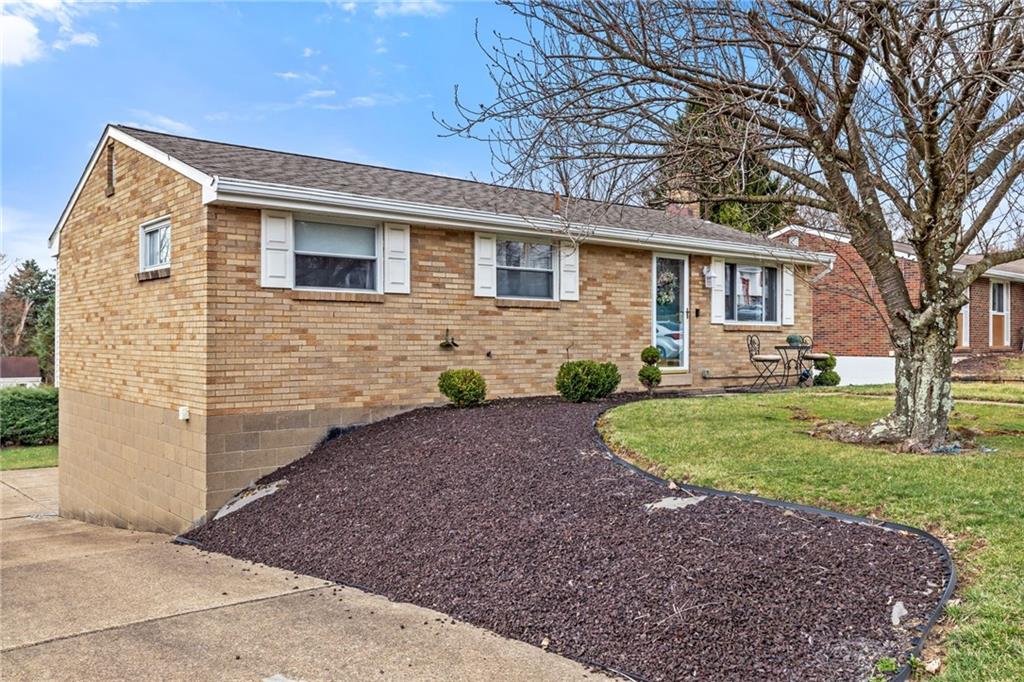 1075 Fiddleback Drive McKees Rocks, PA 15136 - Photo 2 of 34 a front view of a house with garden