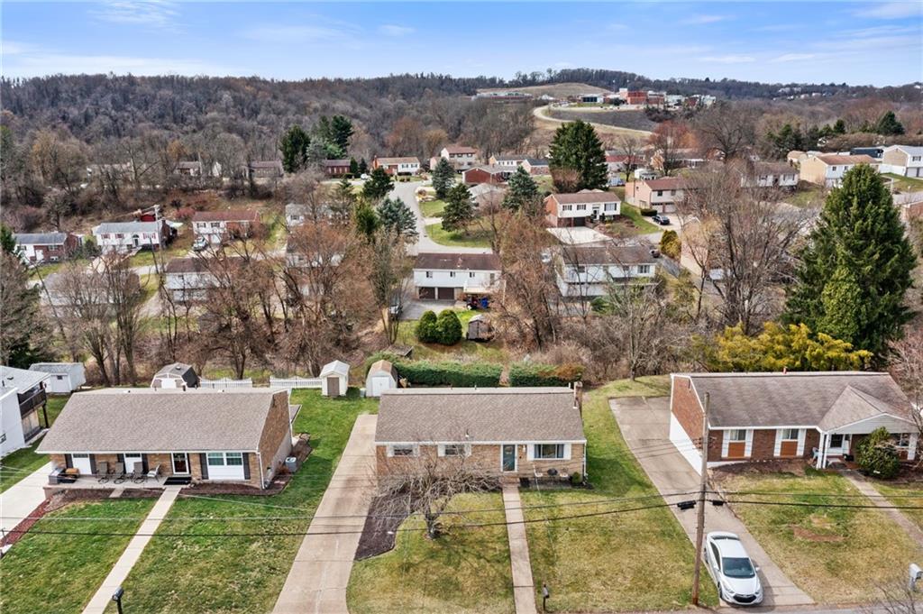 1075 Fiddleback Drive McKees Rocks, PA 15136 - Photo 34 of 34 an aerial view of a house with a garden and trees