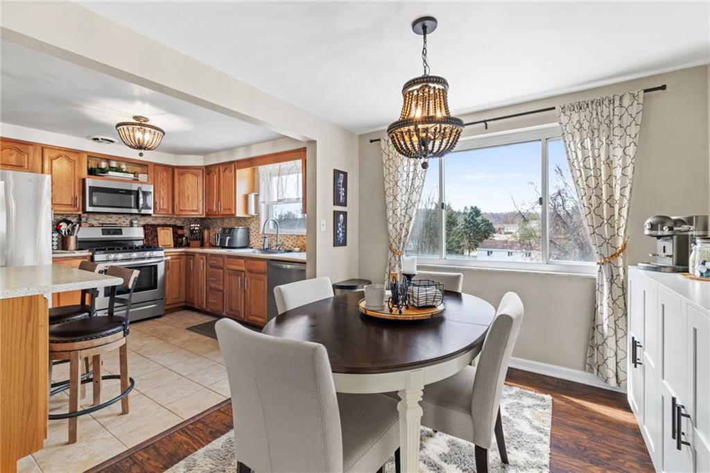 1075 Fiddleback Drive McKees Rocks, PA 15136 - Photo 10 of 34 a open dining room with stainless steel appliances furniture a window and kitchen view