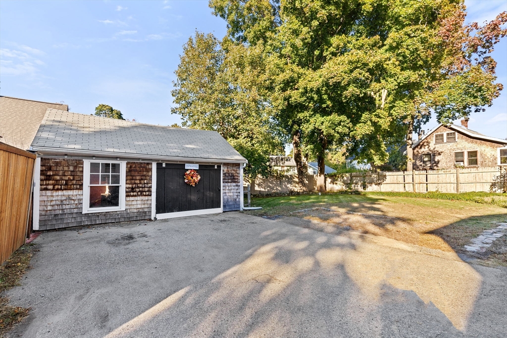 502 Main Street Hingham, MA 02043 - Photo 33 of 34 a front view of a house with a yard and garage