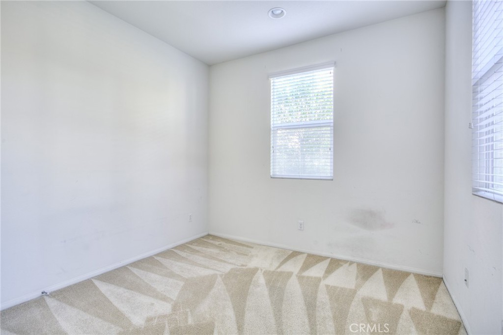 16001 Chase Road, Unit 53 Fontana, CA 92336 - Photo 11 of 32 an empty room with a window