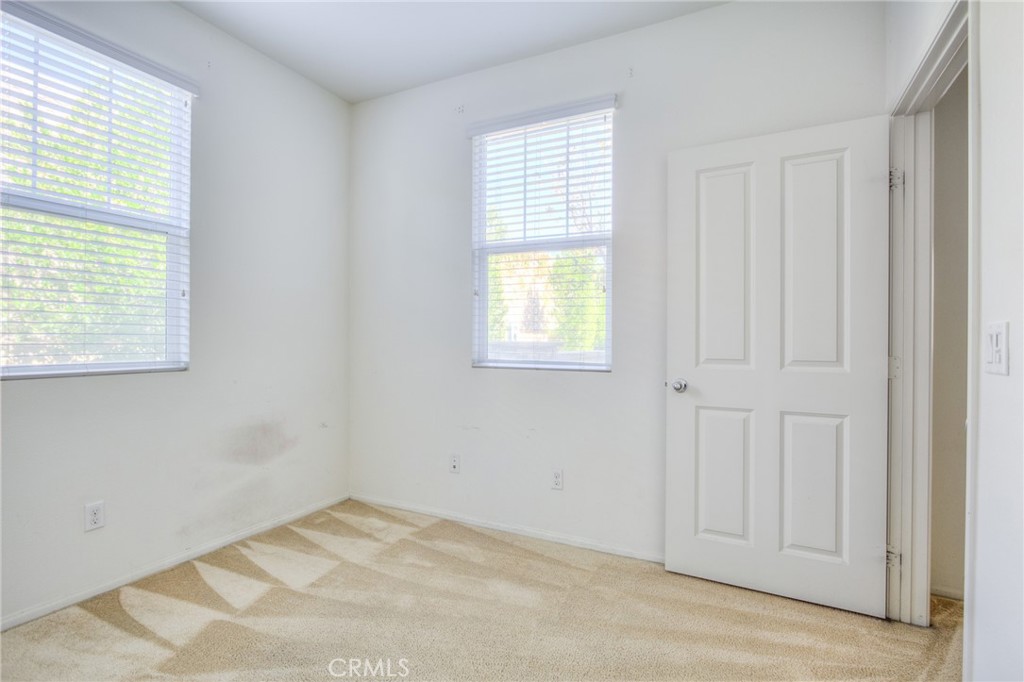 16001 Chase Road, Unit 53 Fontana, CA 92336 - Photo 13 of 32 an empty room with windows