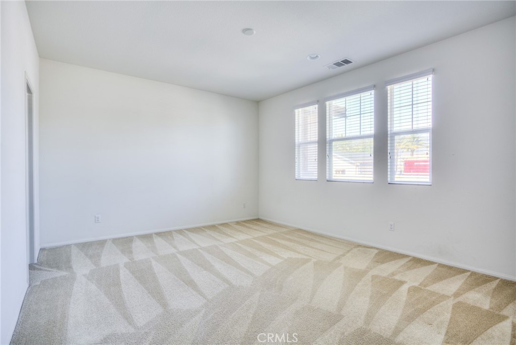 16001 Chase Road, Unit 53 Fontana, CA 92336 - Photo 17 of 32 an empty room with a window