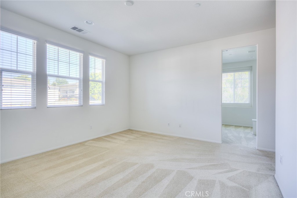 16001 Chase Road, Unit 53 Fontana, CA 92336 - Photo 19 of 32 an empty room with windows