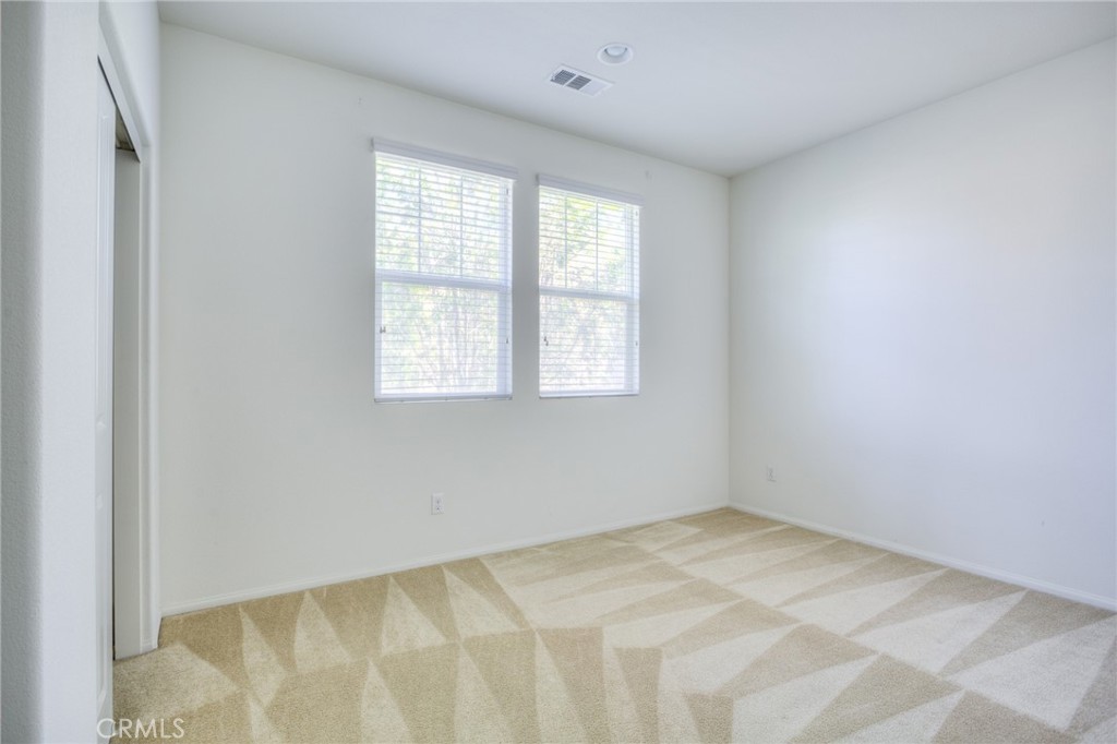 16001 Chase Road, Unit 53 Fontana, CA 92336 - Photo 25 of 32 an empty room with a window