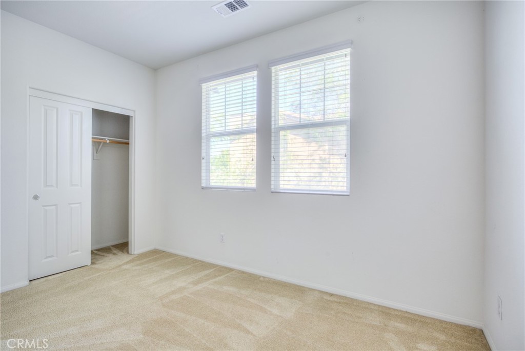 16001 Chase Road, Unit 53 Fontana, CA 92336 - Photo 27 of 32 an empty room with a window