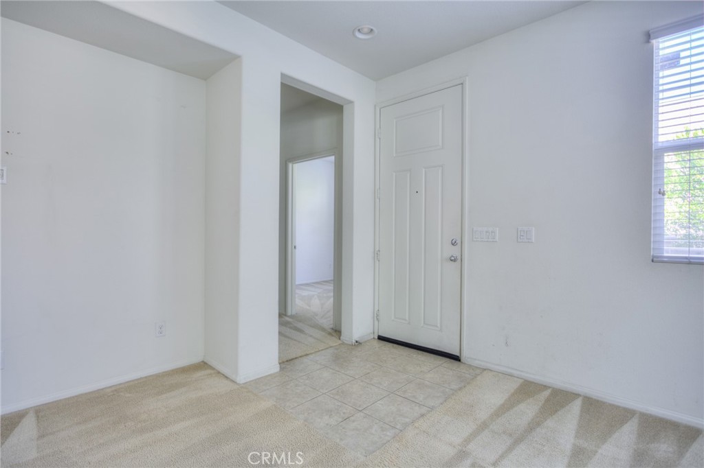 16001 Chase Road, Unit 53 Fontana, CA 92336 - Photo 4 of 32 an empty room with windows