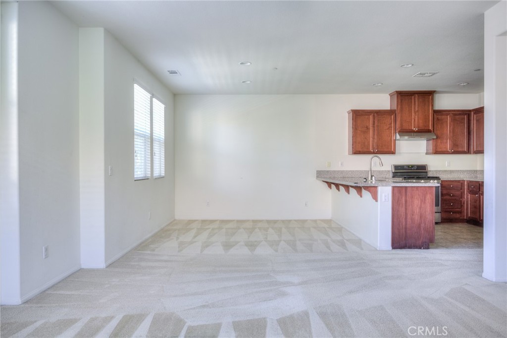 16001 Chase Road, Unit 53 Fontana, CA 92336 - Photo 8 of 32 a view of kitchen with wooden floor