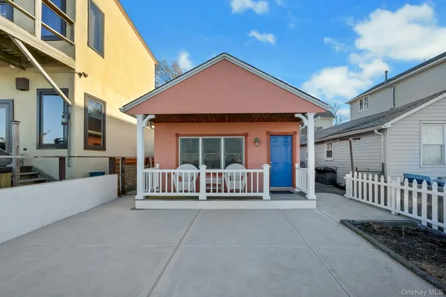 a view of a house with porch and furniture