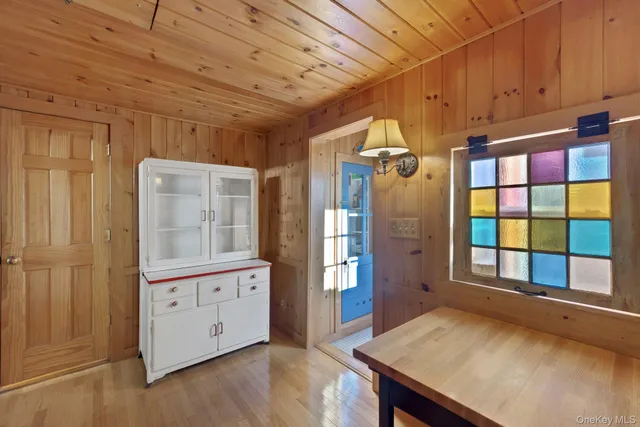 a view of an entryway with wooden floor