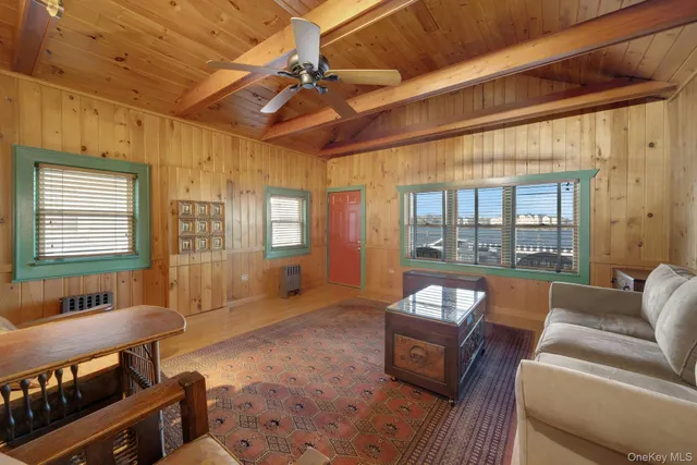 a living room with furniture and a glass door