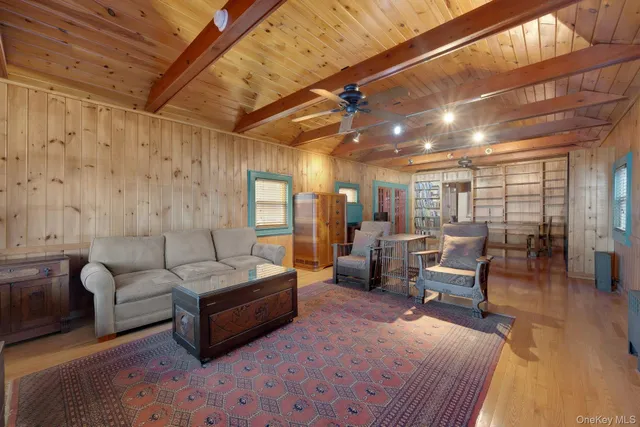 a view of a workspace with furniture window and wooden floor