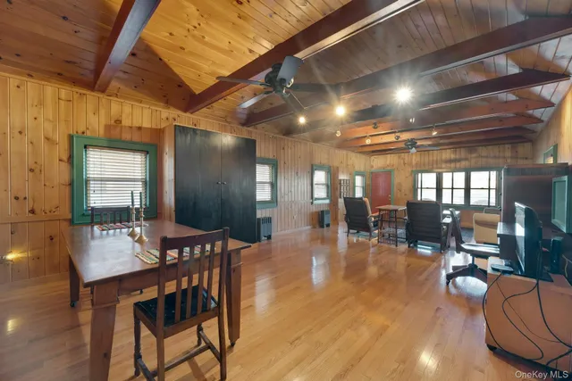 a room with a wooden floor and a sink